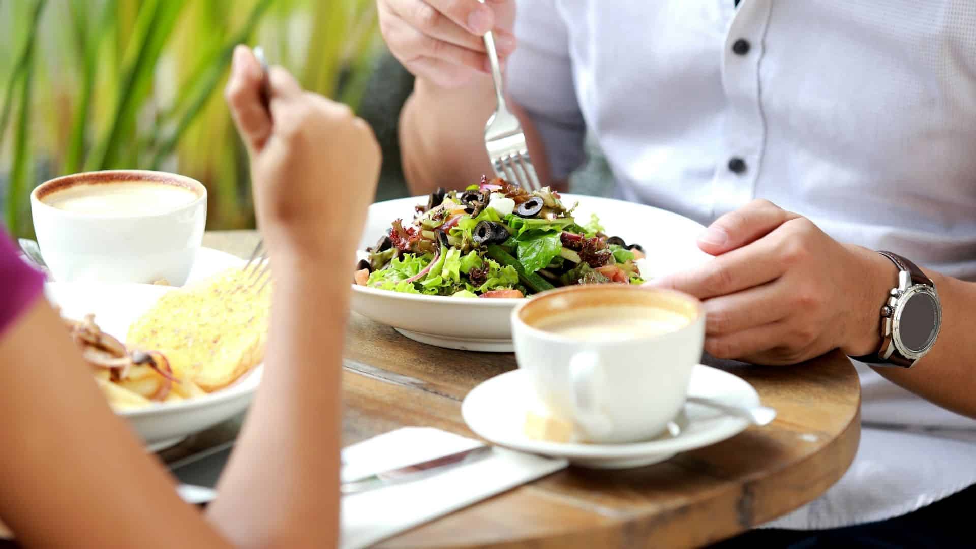 a couple eating lunch at a cafe