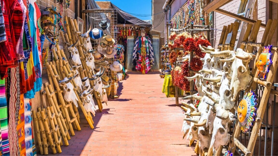 a market with native american goods in an alley in santa fe